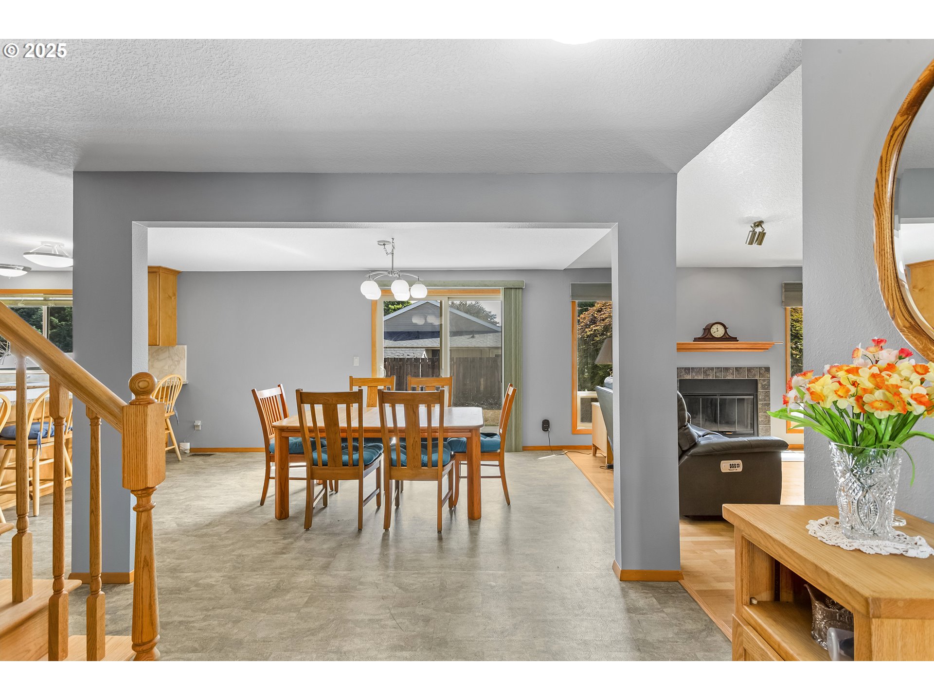 9630 Southwest Robbins Drive Beaverton, OR 97008 - Photo 5 of 35 a dining room with furniture potted plants and wooden floor