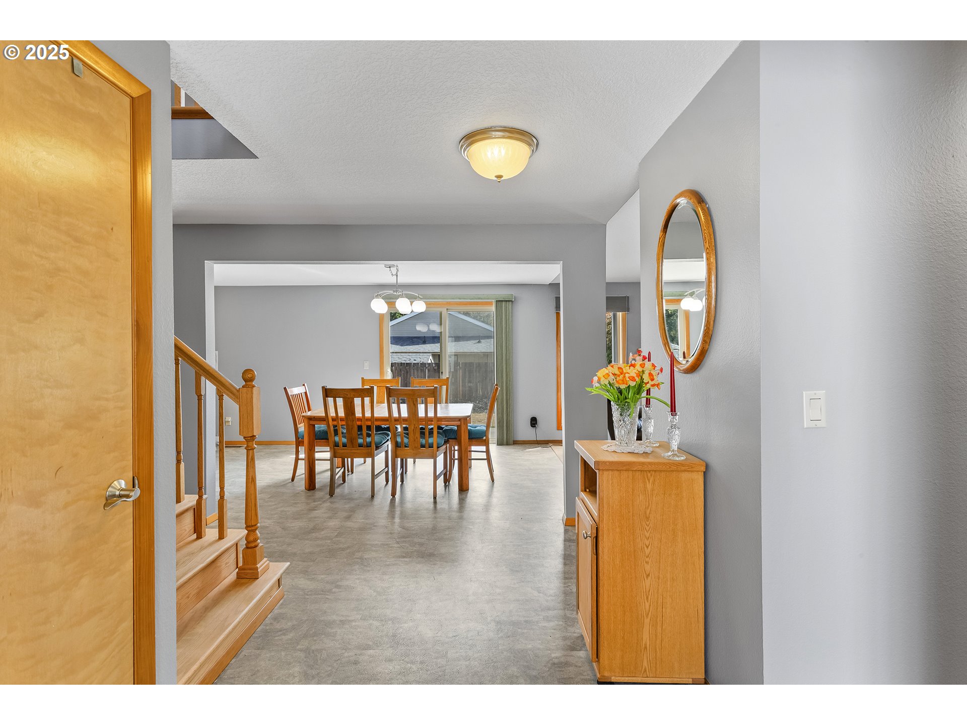 9630 Southwest Robbins Drive Beaverton, OR 97008 - Photo 6 of 35 a living room with furniture and a dining table with garden view