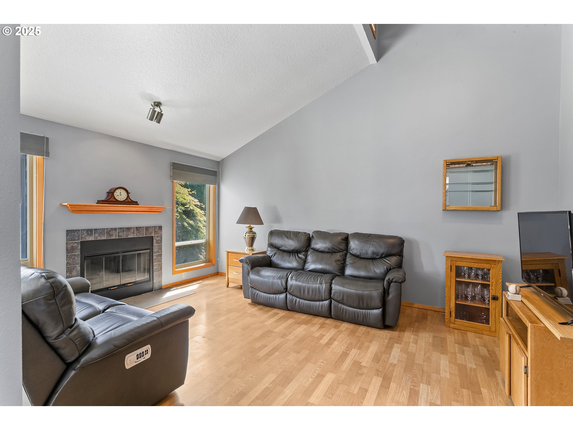 9630 Southwest Robbins Drive Beaverton, OR 97008 - Photo 7 of 35 a living room with furniture and a fireplace