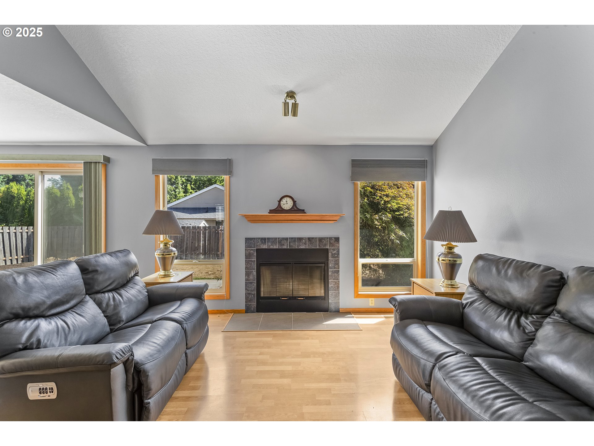 9630 Southwest Robbins Drive Beaverton, OR 97008 - Photo 8 of 35 a living room with furniture and a fireplace