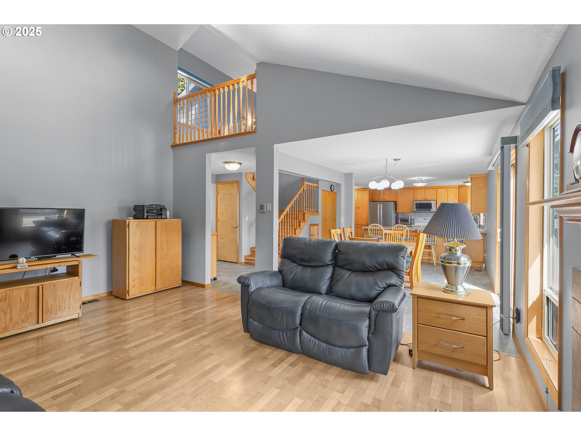 9630 Southwest Robbins Drive Beaverton, OR 97008 - Photo 9 of 35 a living room with furniture and a flat screen tv