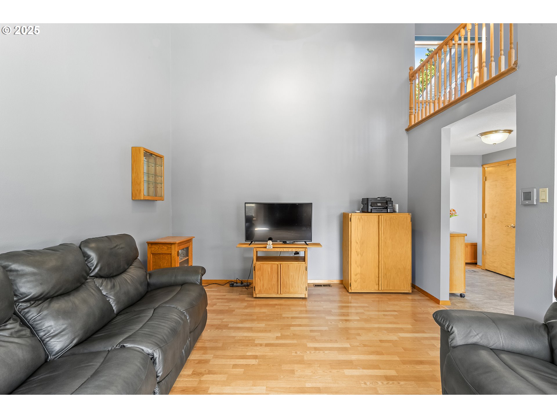 9630 Southwest Robbins Drive Beaverton, OR 97008 - Photo 10 of 35 a living room with furniture and a flat screen tv