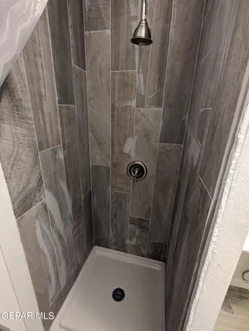 a bathroom with a sink and shower