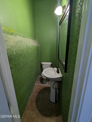a bathroom with a sink and mirror