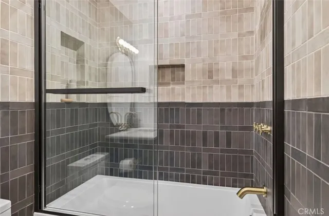 a utility room with washing machine