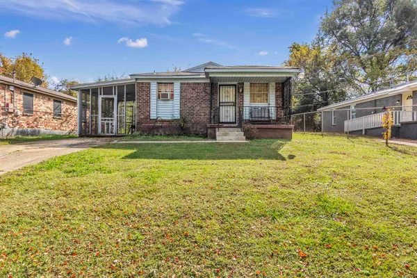 a view of a house with a yard and swimming pool