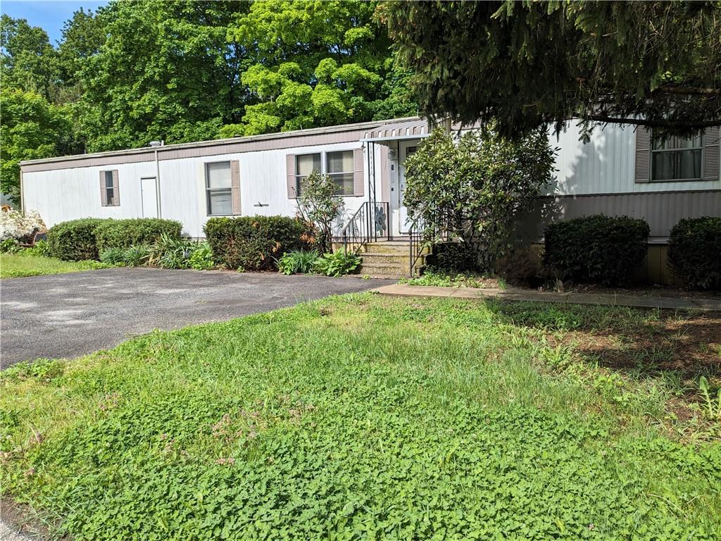 5 4th Street Cold Spring, NY 10516 - Photo 1 of 1 a view of a house with a yard and a patio