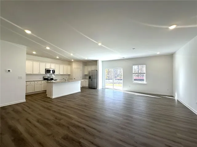 a stove top oven sitting inside of a kitchen