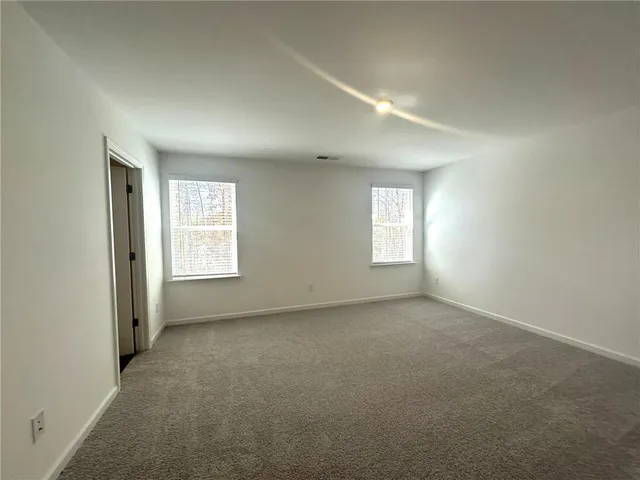 a bathroom with a toilet and a sink