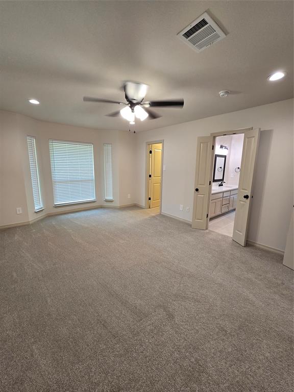 3601 Scott Drive Rowlett, TX 75088 - Photo 10 of 19 a view of an empty room with a ceiling fan