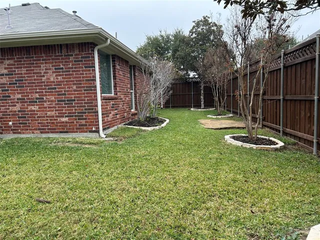 a view of a backyard with a small cabin