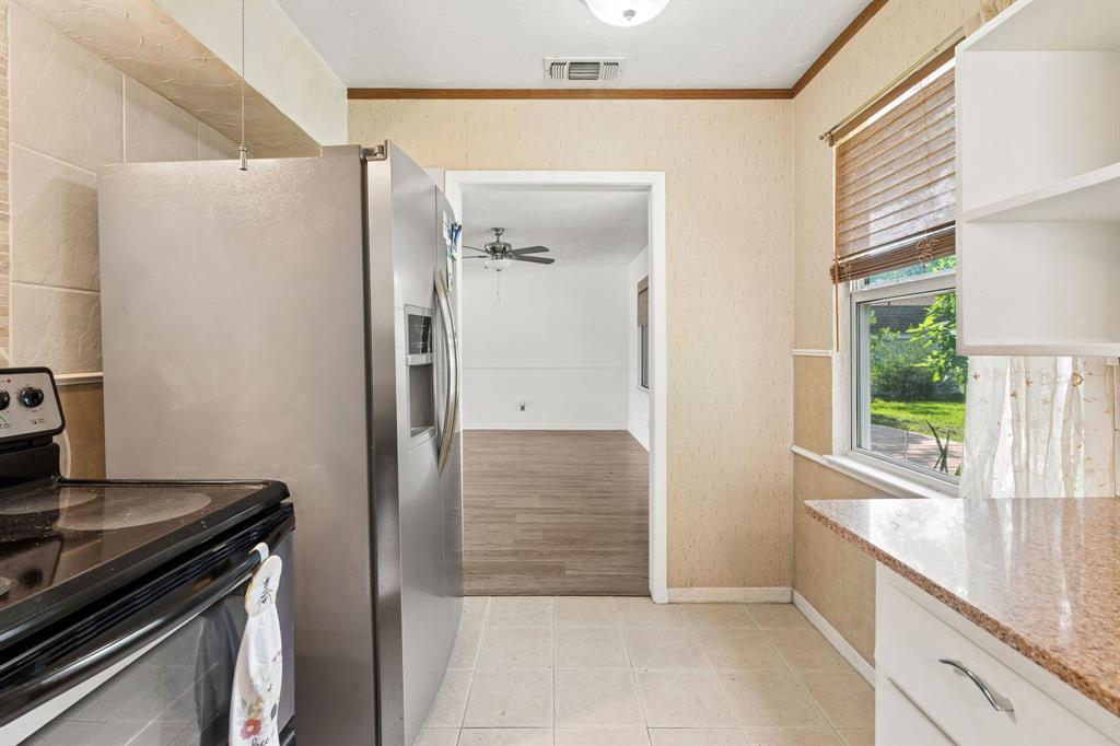 1822 Finley Road Irving, TX 75062 - Photo 18 of 38 a view of kitchen with wooden floor and electronic appliances