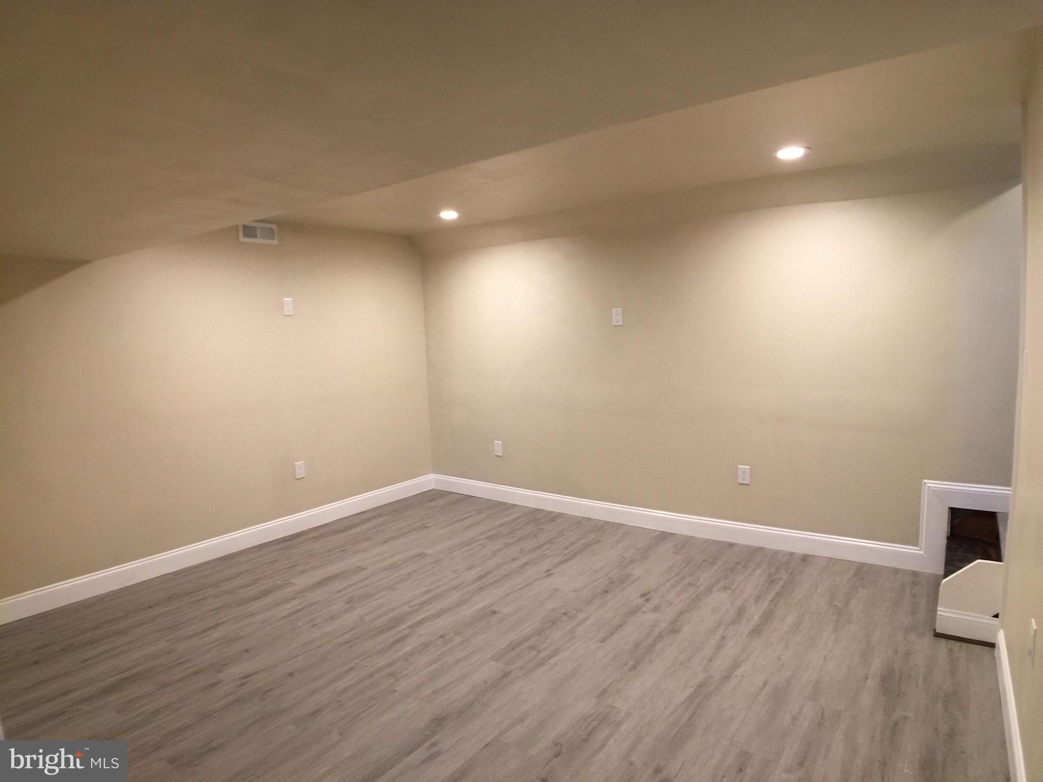 853 Reece Road Severn, MD 21144 - Photo 38 of 54 Lower-level media room