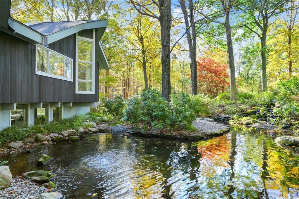 161 Old Huckleberry Road Wilton, CT 06897 - Photo 1 of 1 This Koi pond is breathtaking! The dining room and kitchen overlook this space. Private sitting area overlooks the waterfall. (Koi not included.)