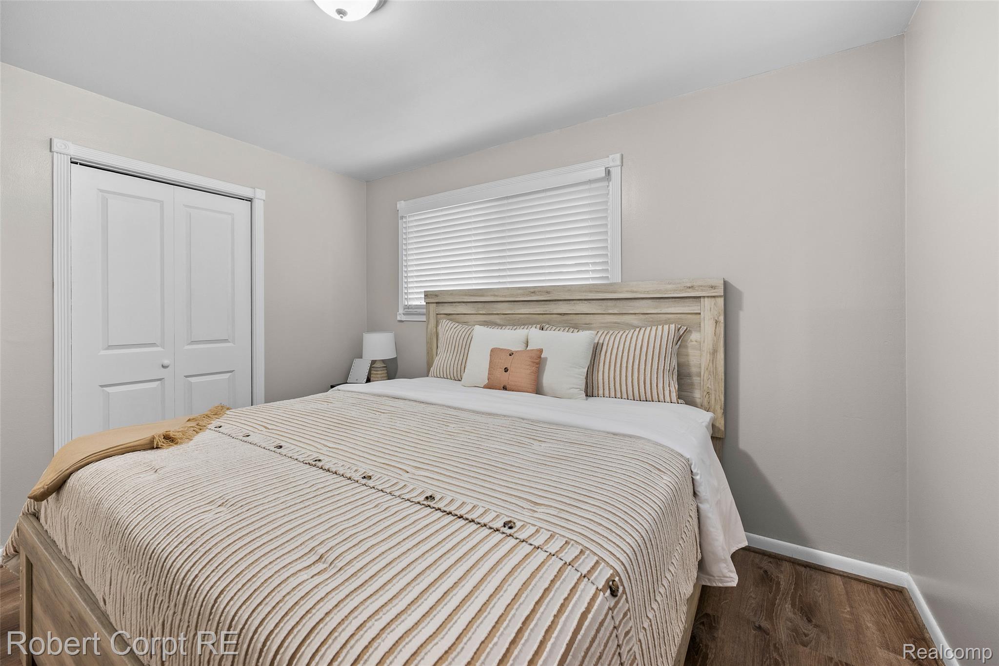 4772 Harding Street Dearborn Heights, MI 48125 - Photo 15 of 22 Bedroom with a closet and dark wood-style flooring