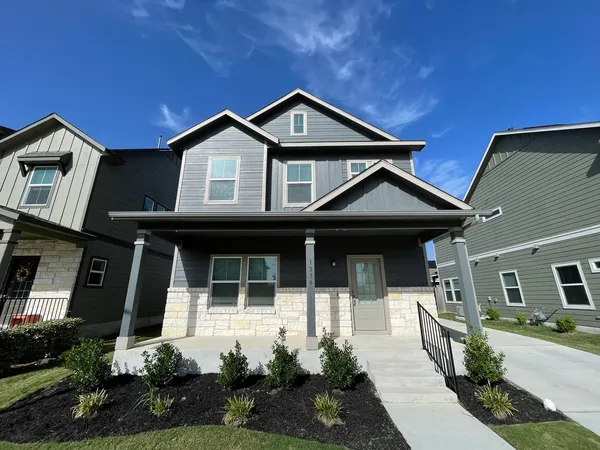 a front view of a house with yard