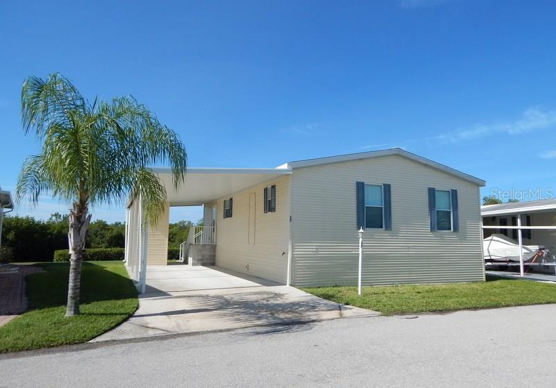 37 Hague Road Punta Gorda, FL 33950 - Photo 1 of 1 Front view, 2-car covered parking