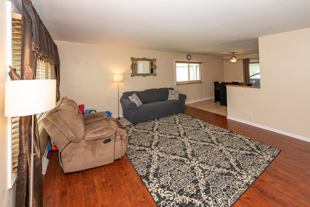 8 Durango Road Montgomery, IL 60538 - Photo 8 of 33 a living room with furniture and wooden floor
