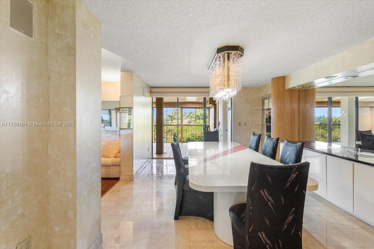 2808 North 46th Avenue, Unit E650 Hollywood, FL 33021 - Photo 16 of 45 a dining room with furniture and window