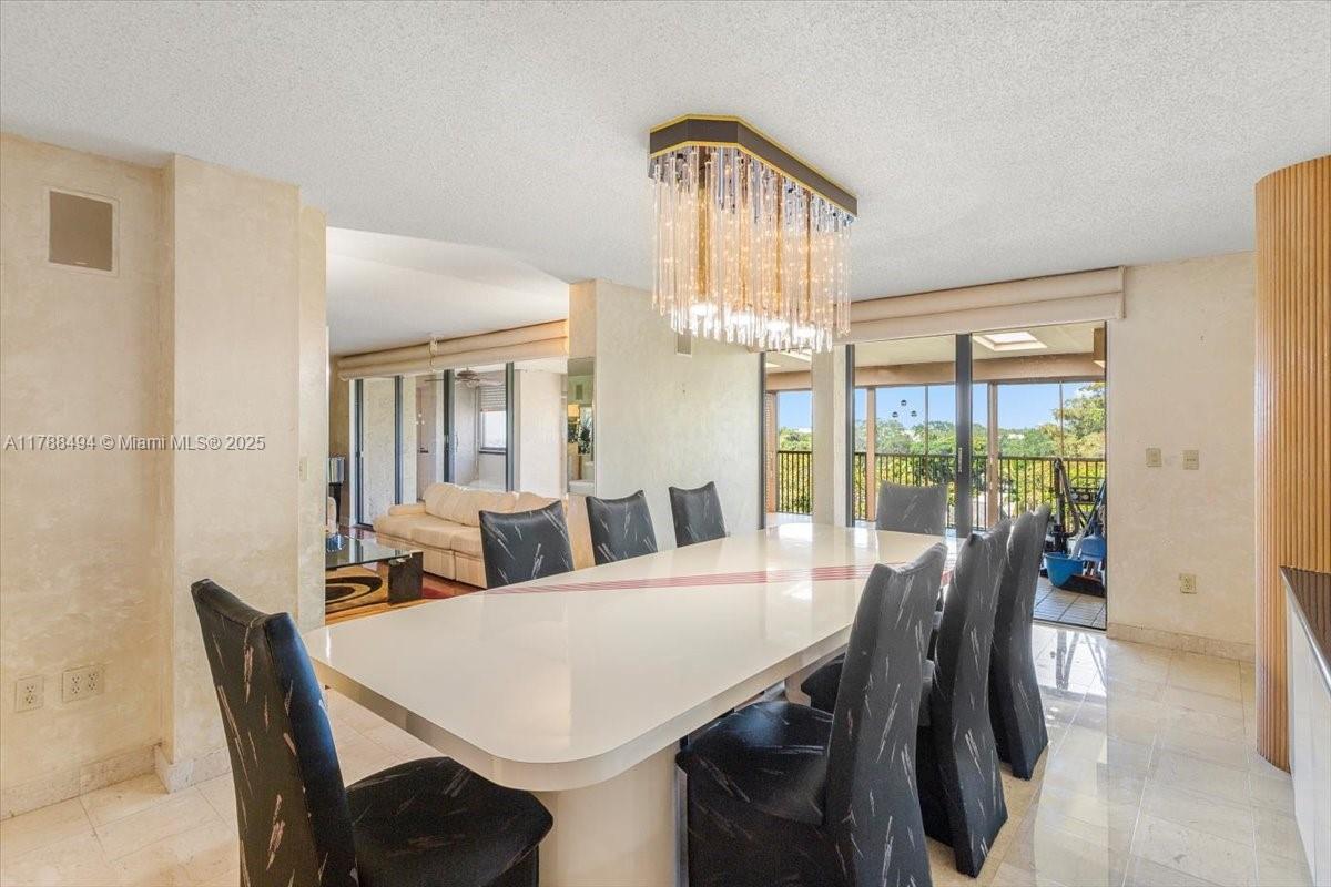 2808 North 46th Avenue, Unit E650 Hollywood, FL 33021 - Photo 17 of 45 a view of a dining room with furniture window and wooden floor