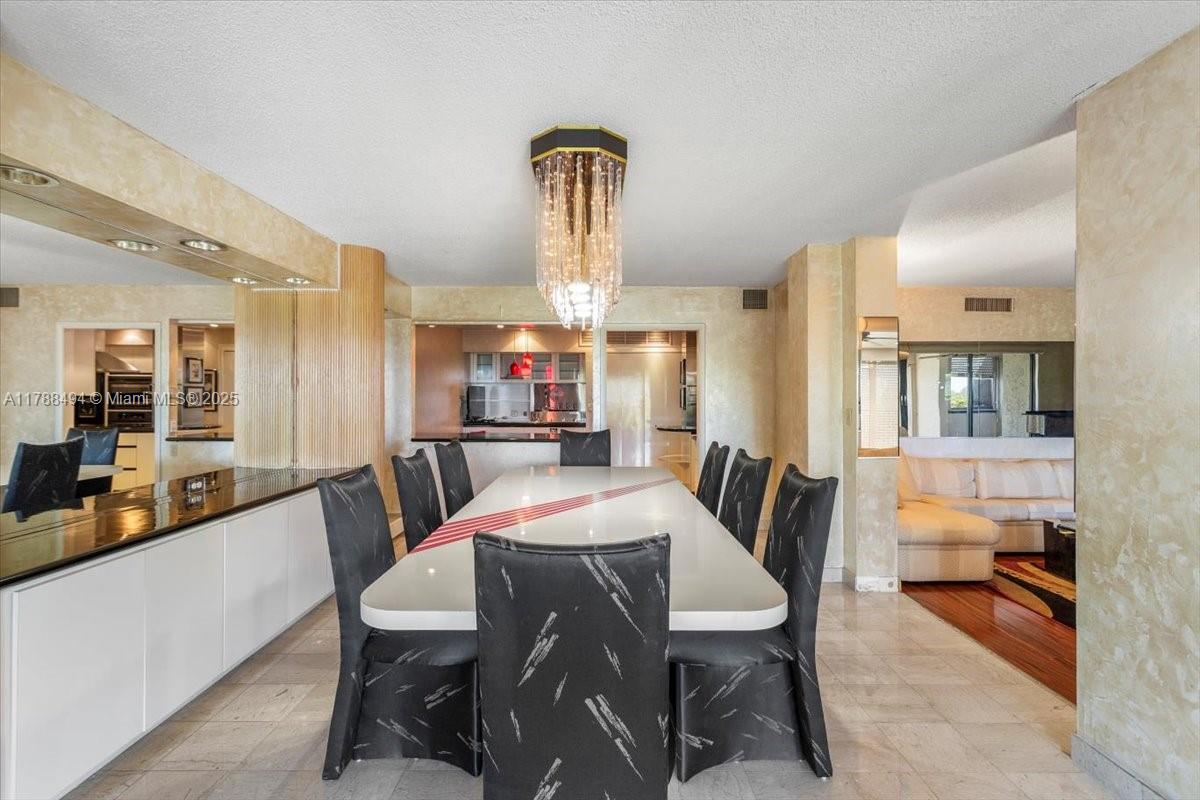 2808 North 46th Avenue, Unit E650 Hollywood, FL 33021 - Photo 18 of 45 a view of a dining room with furniture
