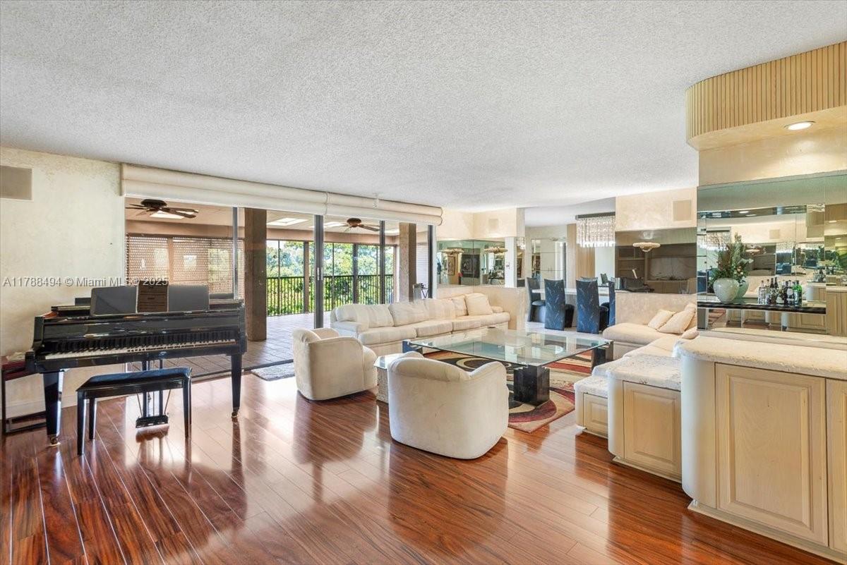 2808 North 46th Avenue, Unit E650 Hollywood, FL 33021 - Photo 19 of 45 a living room with fireplace furniture and a wooden floor