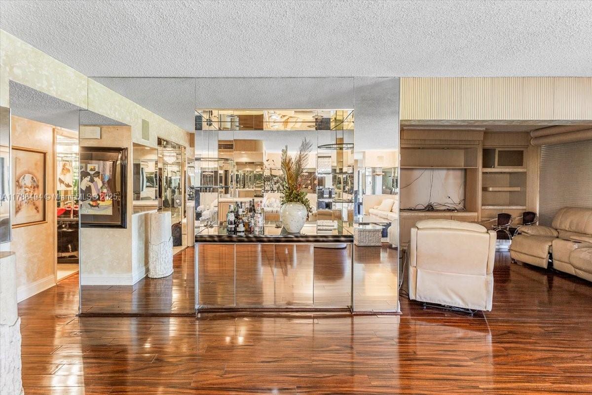 2808 North 46th Avenue, Unit E650 Hollywood, FL 33021 - Photo 21 of 45 a living room with fireplace furniture and a floor to ceiling window