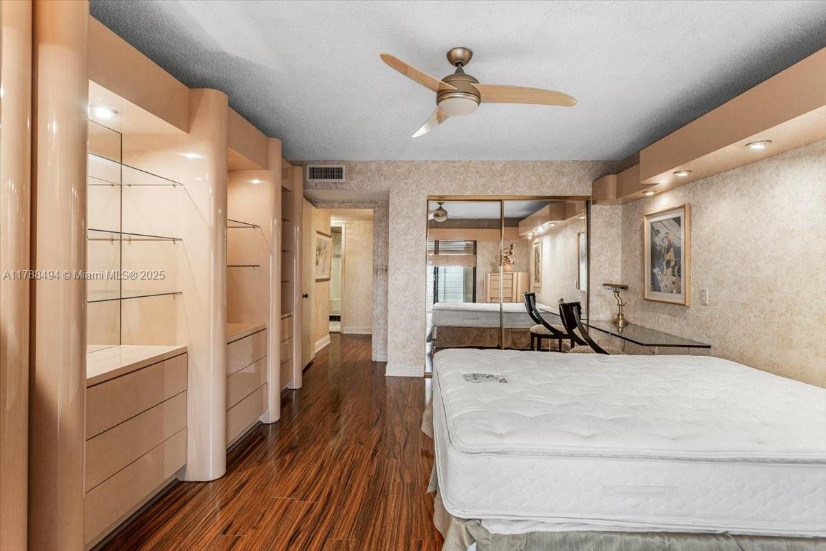 2808 North 46th Avenue, Unit E650 Hollywood, FL 33021 - Photo 27 of 45 a large white room with a large mirror and sink