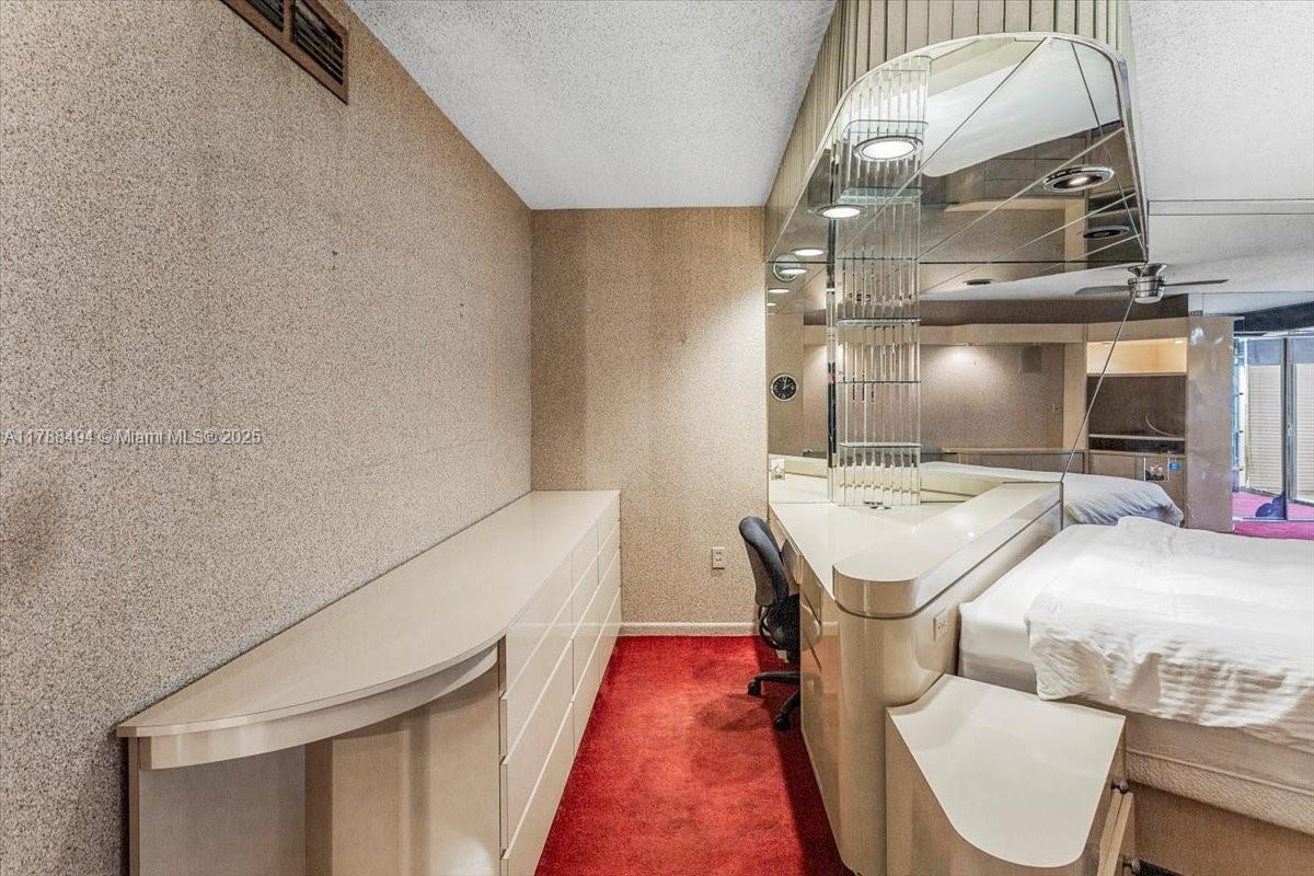 2808 North 46th Avenue, Unit E650 Hollywood, FL 33021 - Photo 29 of 45 a bathroom with a granite countertop sink and a mirror