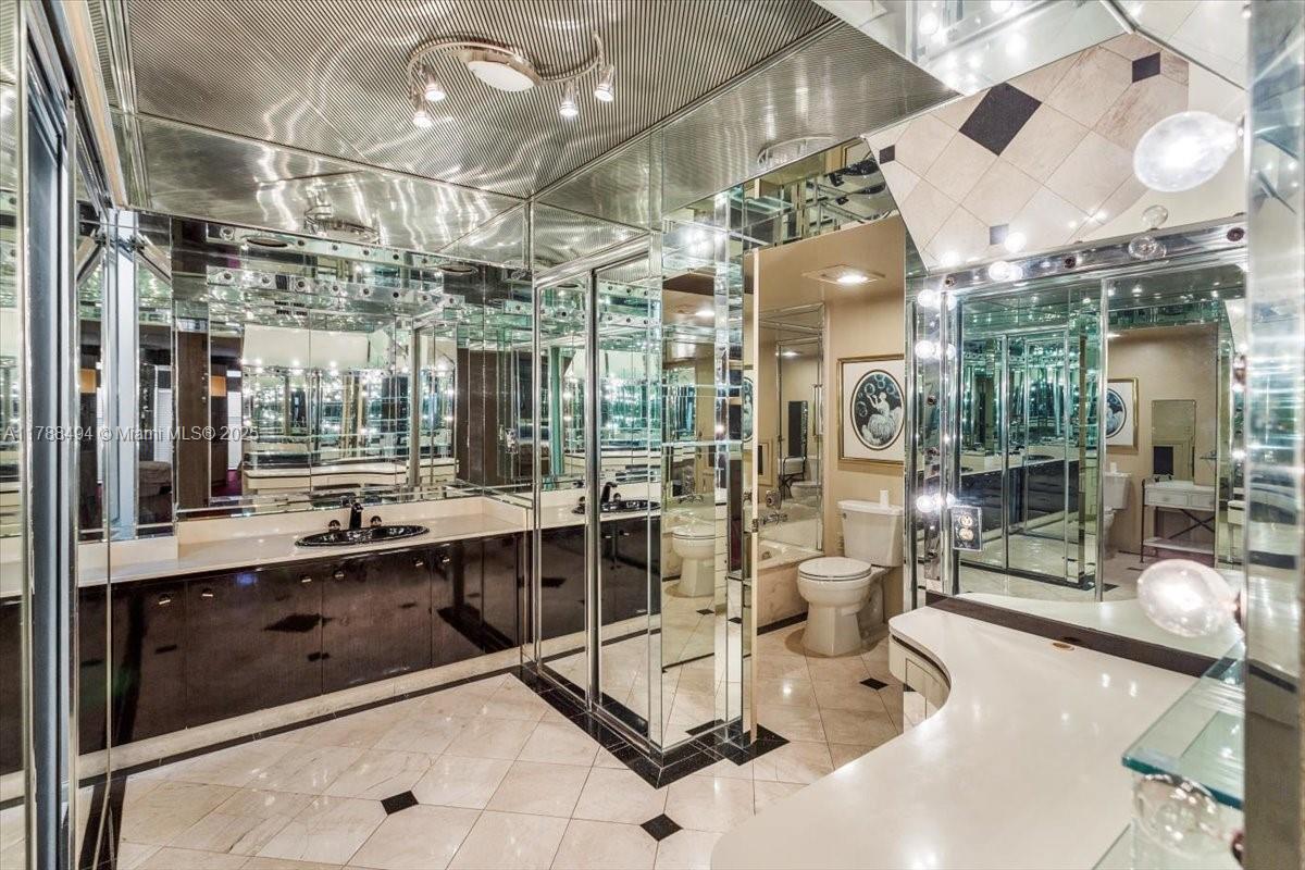 2808 North 46th Avenue, Unit E650 Hollywood, FL 33021 - Photo 34 of 45 a room with lots of gym equipment and shower