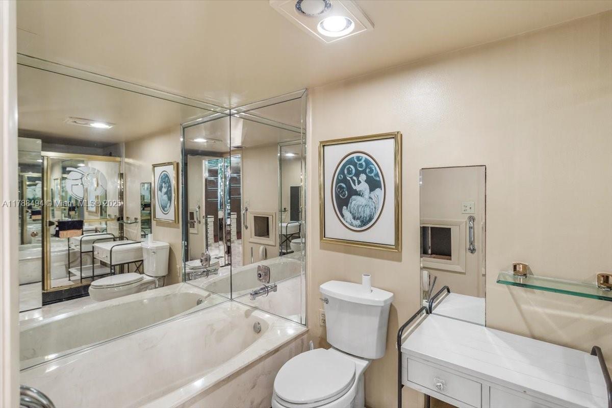 2808 North 46th Avenue, Unit E650 Hollywood, FL 33021 - Photo 36 of 45 a living room with furniture a clock and a large window