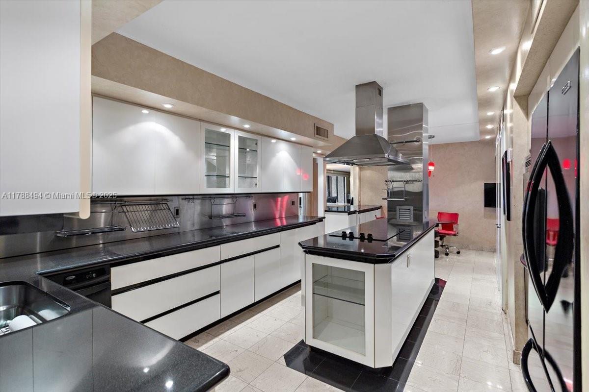 2808 North 46th Avenue, Unit E650 Hollywood, FL 33021 - Photo 4 of 45 a kitchen with stainless steel appliances granite countertop a sink stove and cabinets