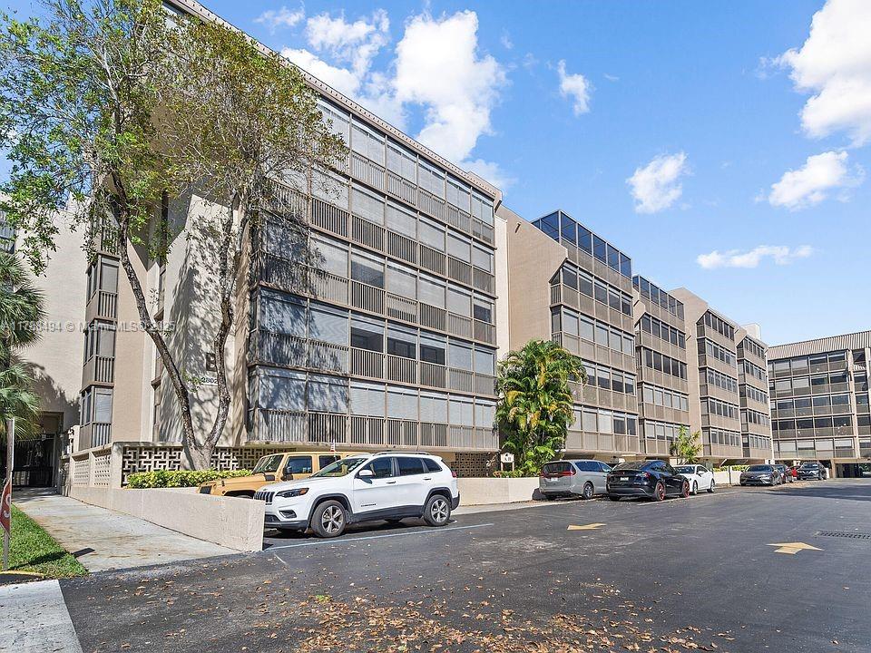 2808 North 46th Avenue, Unit E650 Hollywood, FL 33021 - Photo 44 of 45 a car parked in front of a building