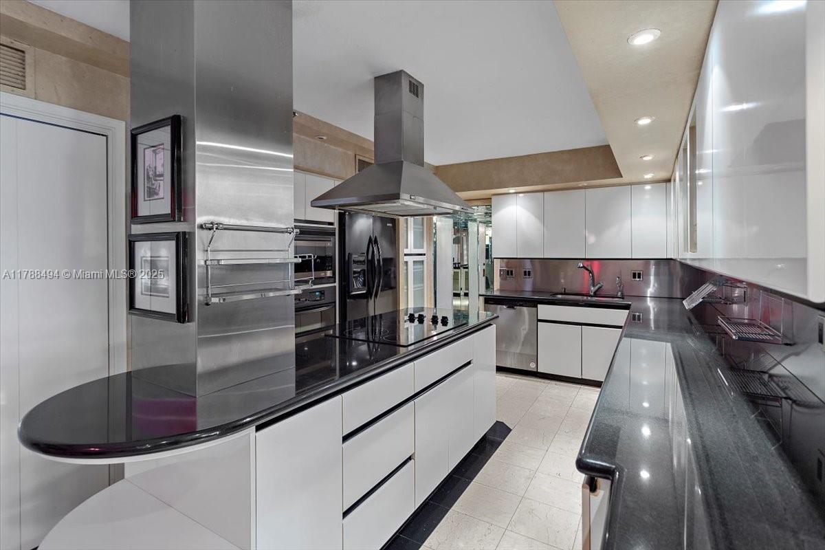 2808 North 46th Avenue, Unit E650 Hollywood, FL 33021 - Photo 8 of 45 a kitchen with stainless steel appliances kitchen island granite countertop a stove and a sink