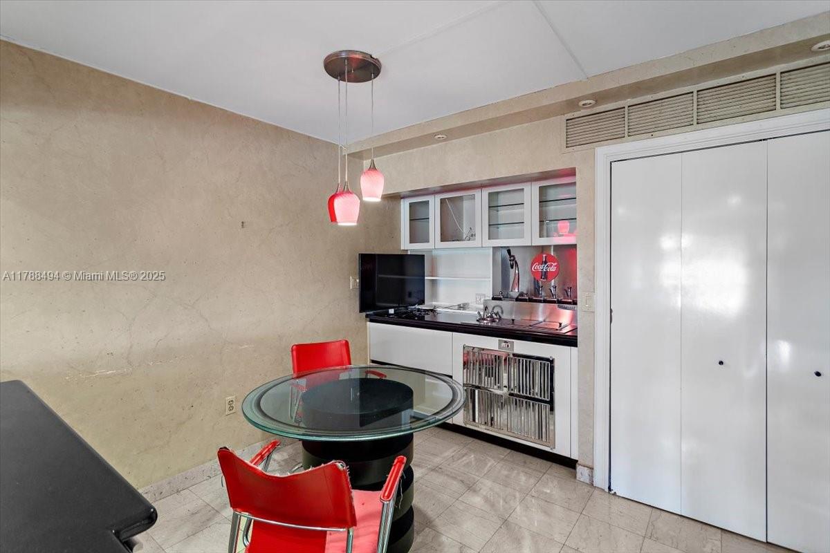 2808 North 46th Avenue, Unit E650 Hollywood, FL 33021 - Photo 9 of 45 a kitchen with stainless steel appliances granite countertop a sink and a refrigerator