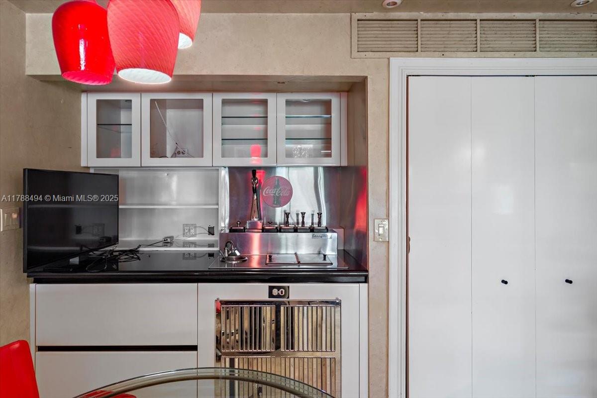 2808 North 46th Avenue, Unit E650 Hollywood, FL 33021 - Photo 10 of 45 a kitchen with a refrigerator and a stove