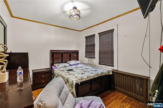 a bedroom with furniture and a window