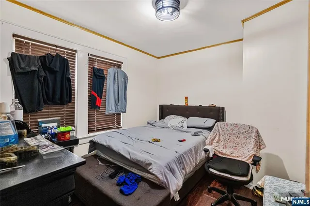 a bedroom with a bed a desk and chair