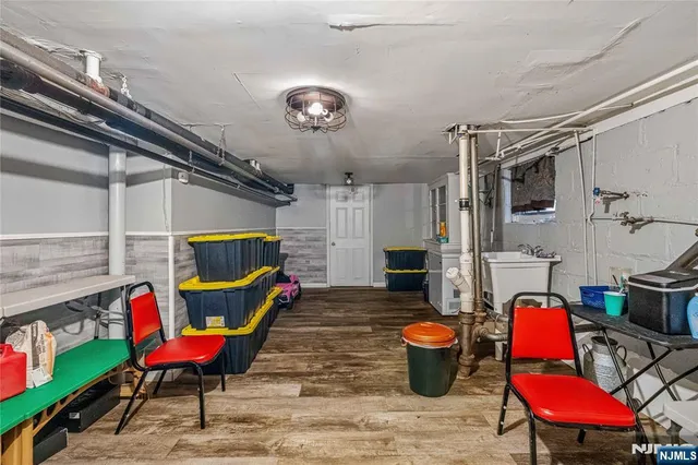 a living room with furniture and a dining table