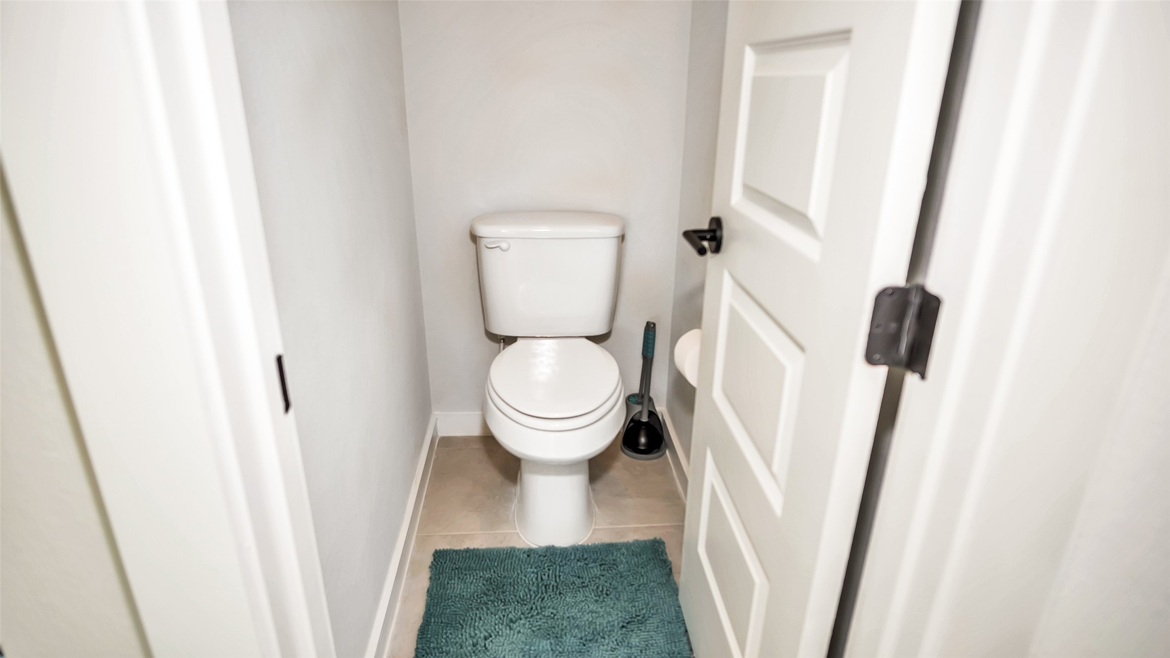 1919 Pueblo Nuevo Path Houston, TX 77077 - Photo 8 of 50 a white toilet sitting next to a sink
