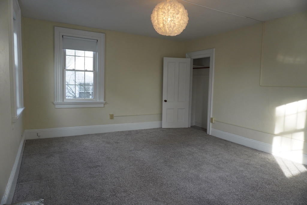28 Court Street Mansfield, MA 02048 - Photo 18 of 39 an empty room that has a window