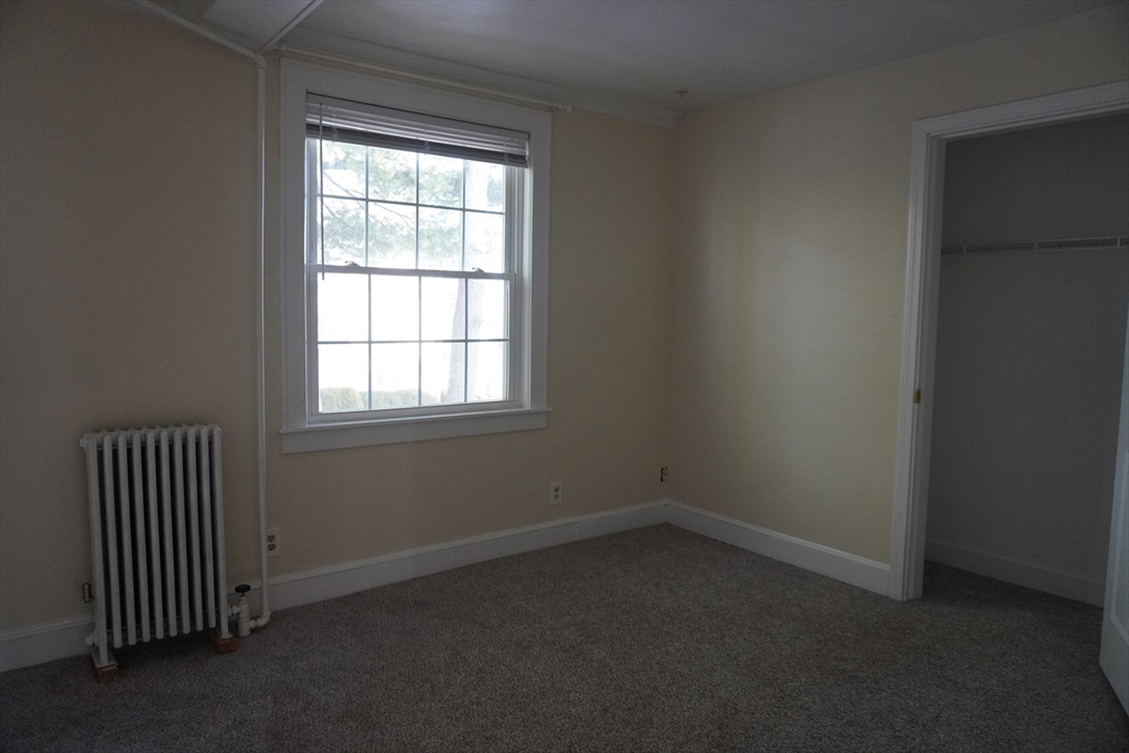 28 Court Street Mansfield, MA 02048 - Photo 22 of 39 an empty room with a window