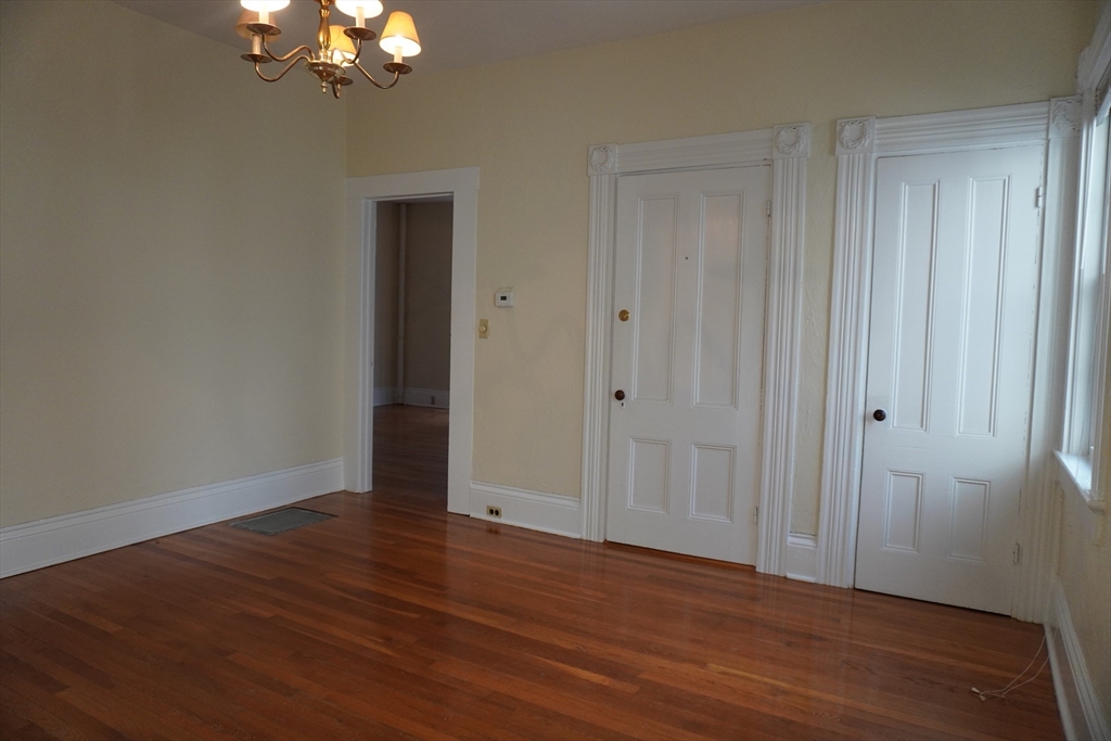 28 Court Street Mansfield, MA 02048 - Photo 26 of 39 a view of an empty room with wooden floor