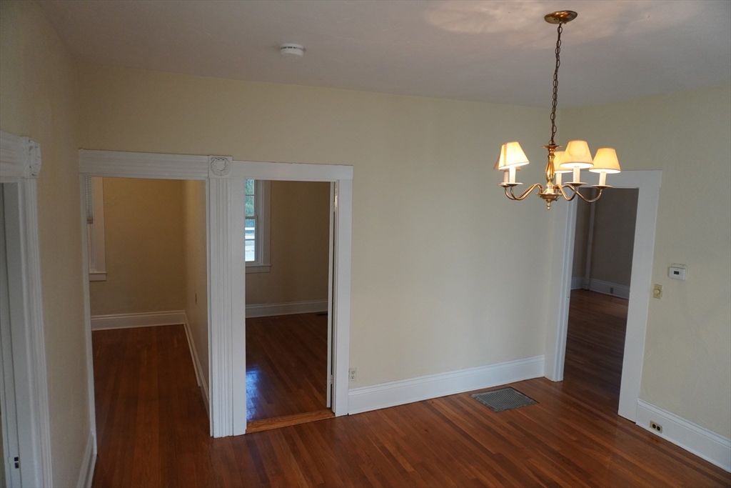 28 Court Street Mansfield, MA 02048 - Photo 27 of 39 a view of a hallway with wooden floor