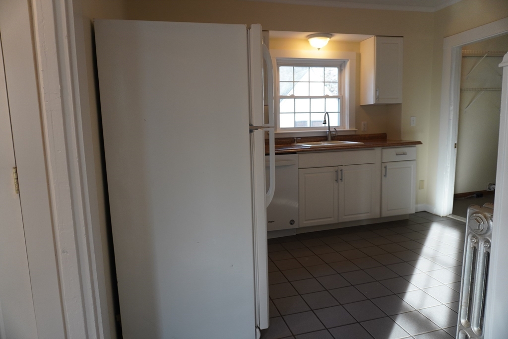28 Court Street Mansfield, MA 02048 - Photo 3 of 39 a kitchen with a sink and cabinets