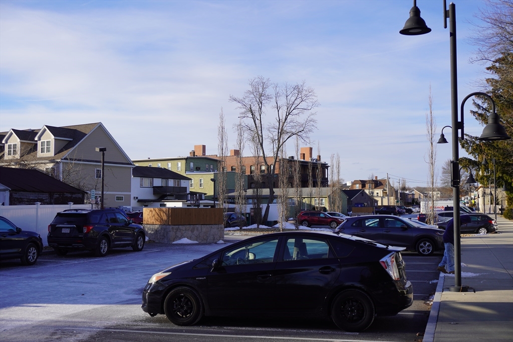 28 Court Street Mansfield, MA 02048 - Photo 36 of 39 a car parked on the side of a street