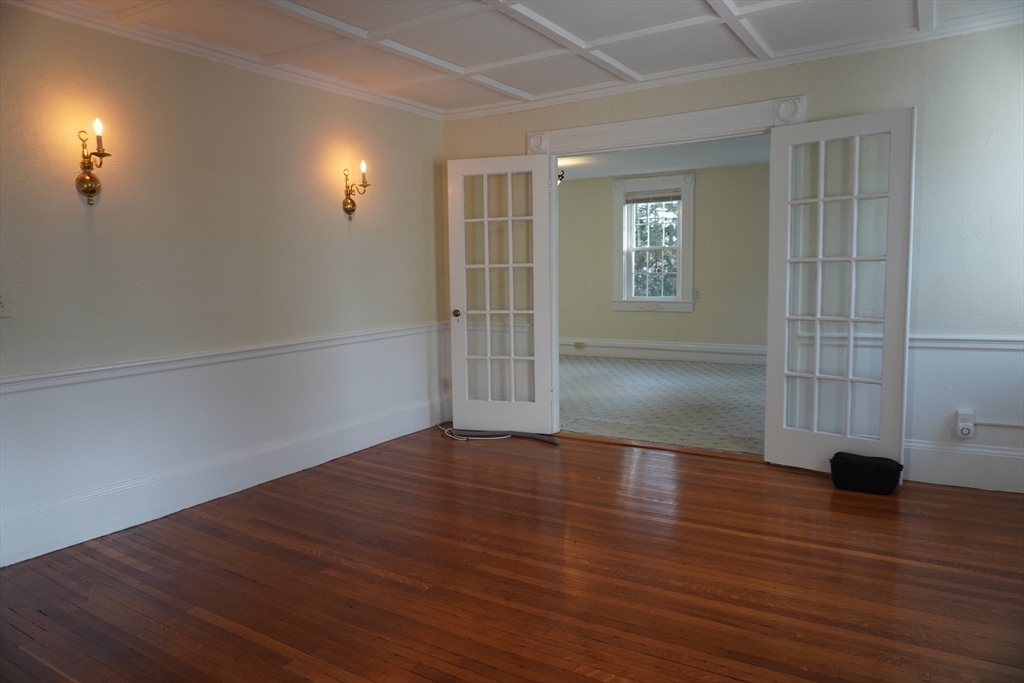 28 Court Street Mansfield, MA 02048 - Photo 10 of 39 an empty room with wooden floor and windows