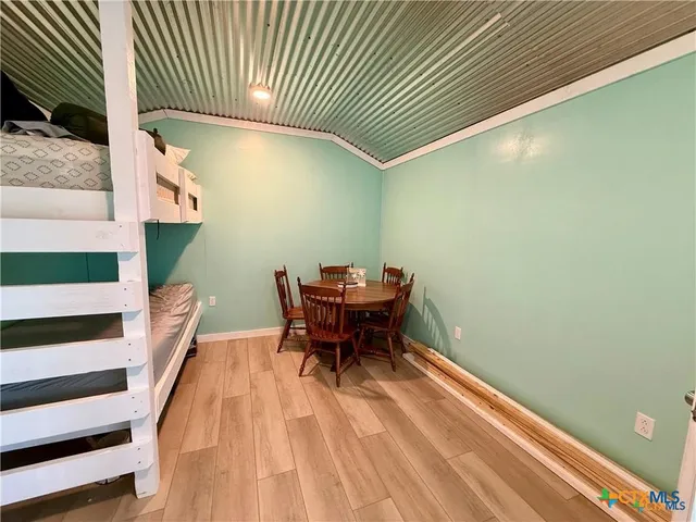 a bathroom with a sink a mirror and a shower