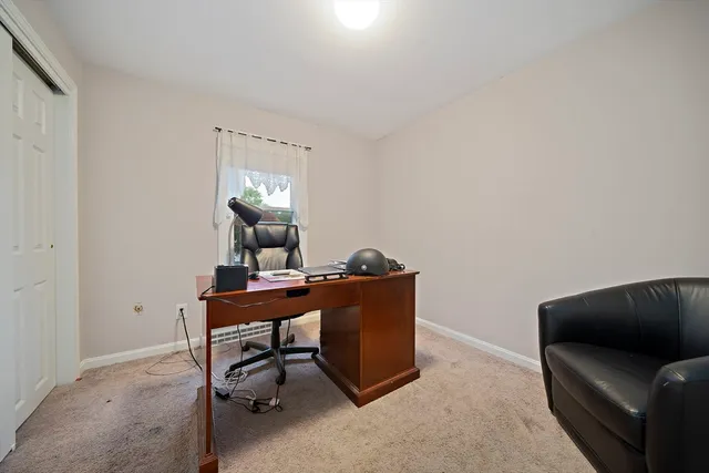 a view of a workspace with furniture