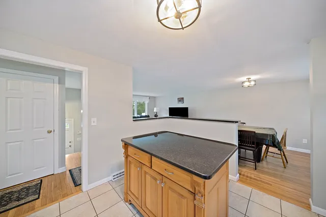 a kitchen with a cabinets a sink and a stove in it